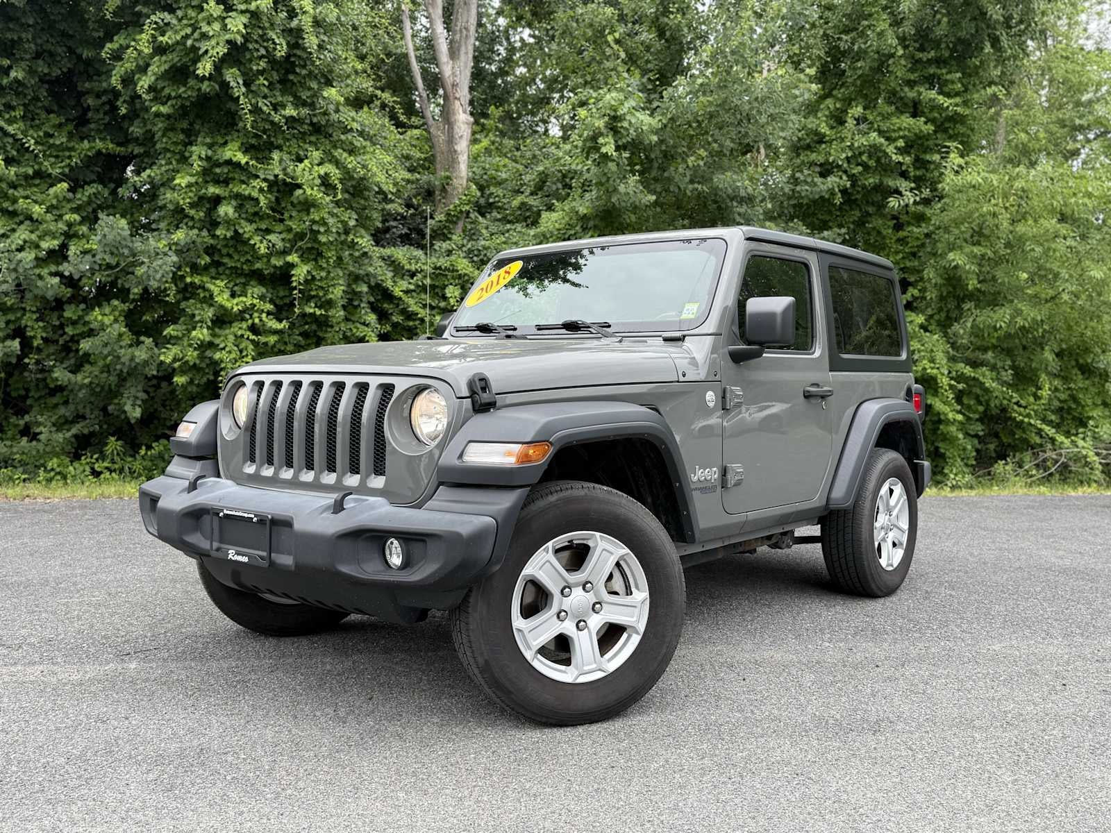 2018 Jeep Wrangler Sport S in Sting-Gray Clearcoat — front three-quarter view