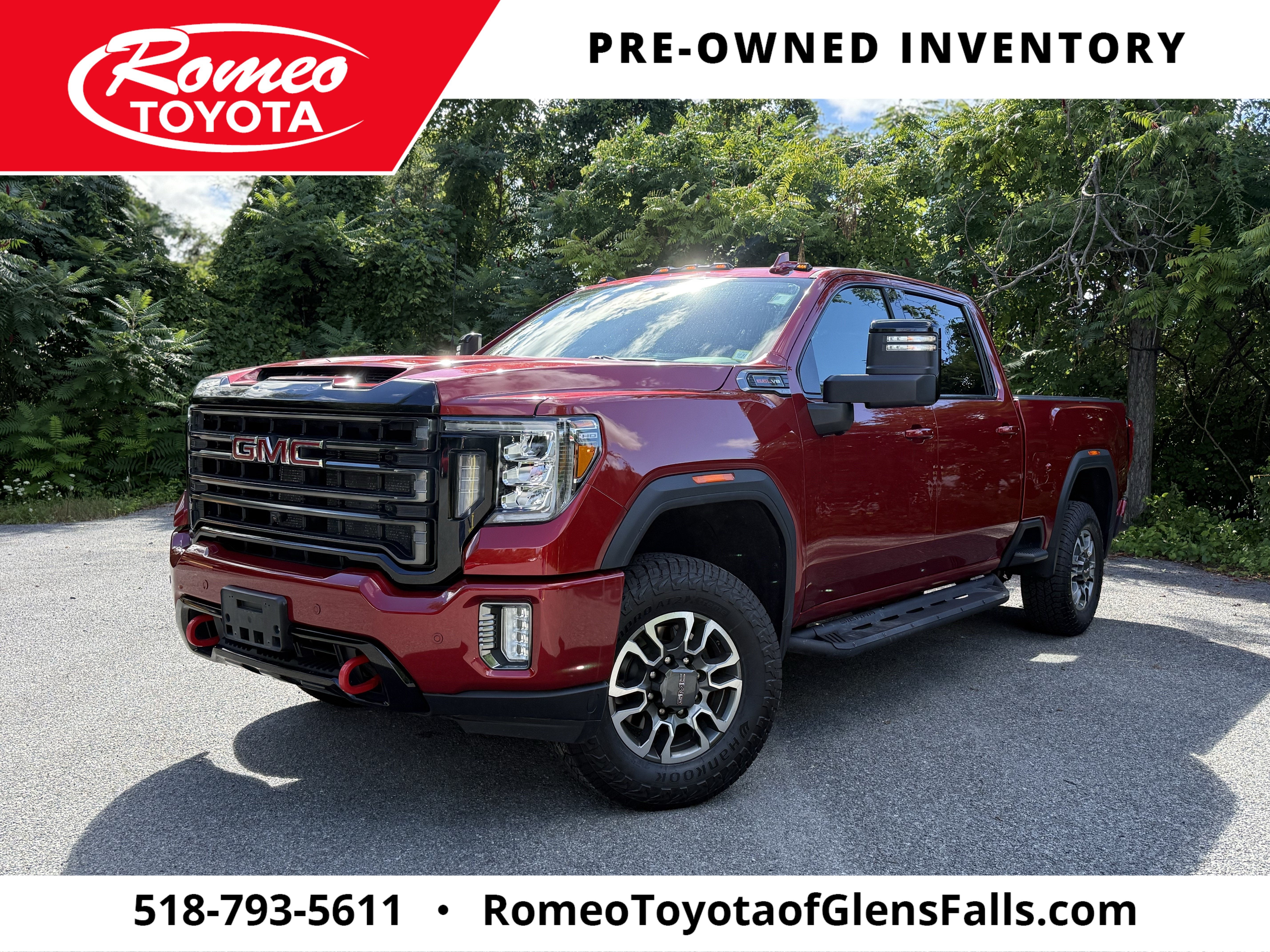 2022 GMC Sierra 2500HD AT4 in Cayenne Red Tintcoat — front three-quarter view