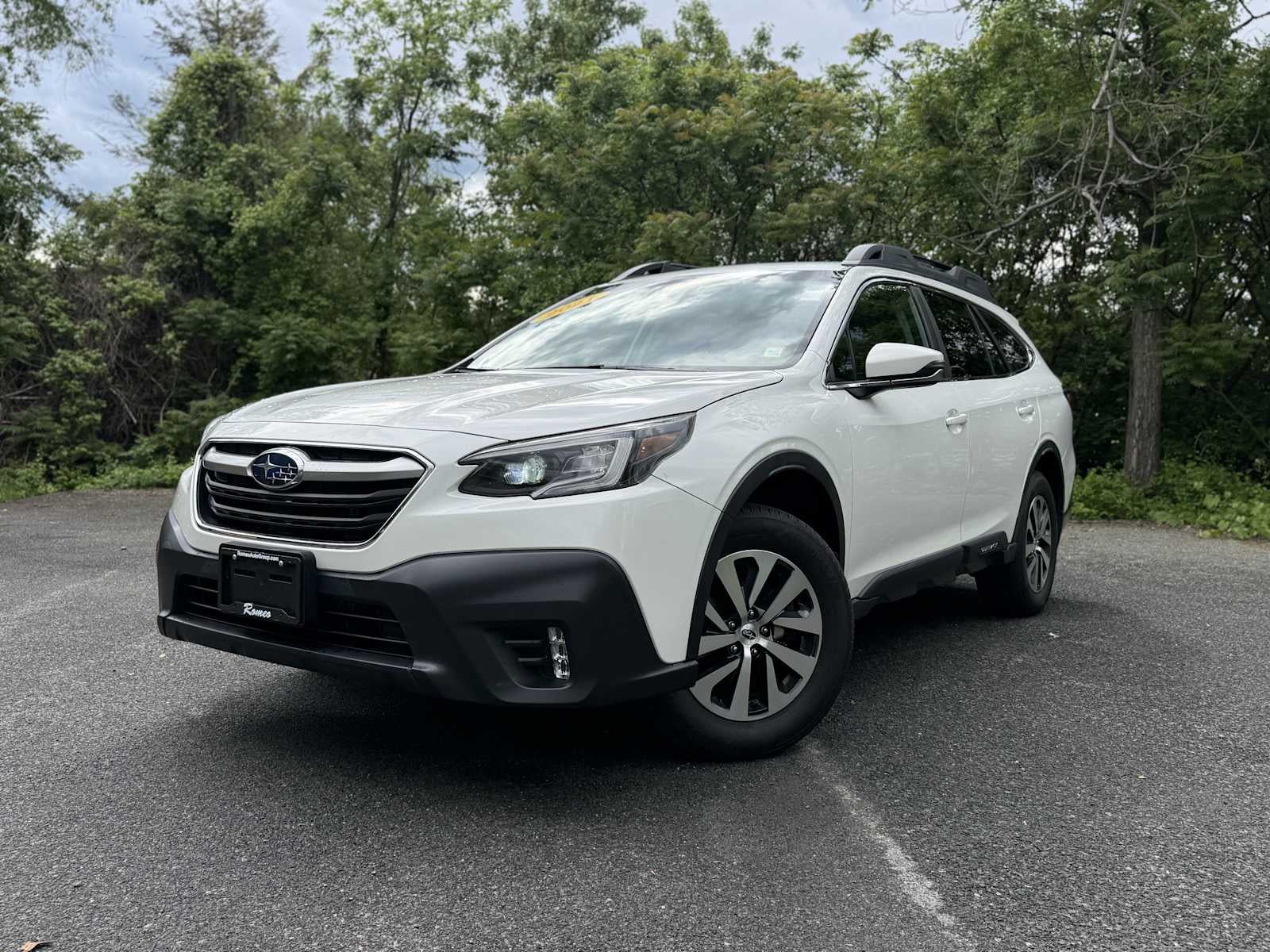 2021 Subaru Outback Premium in Crystal White Pearl — front three-quarter view