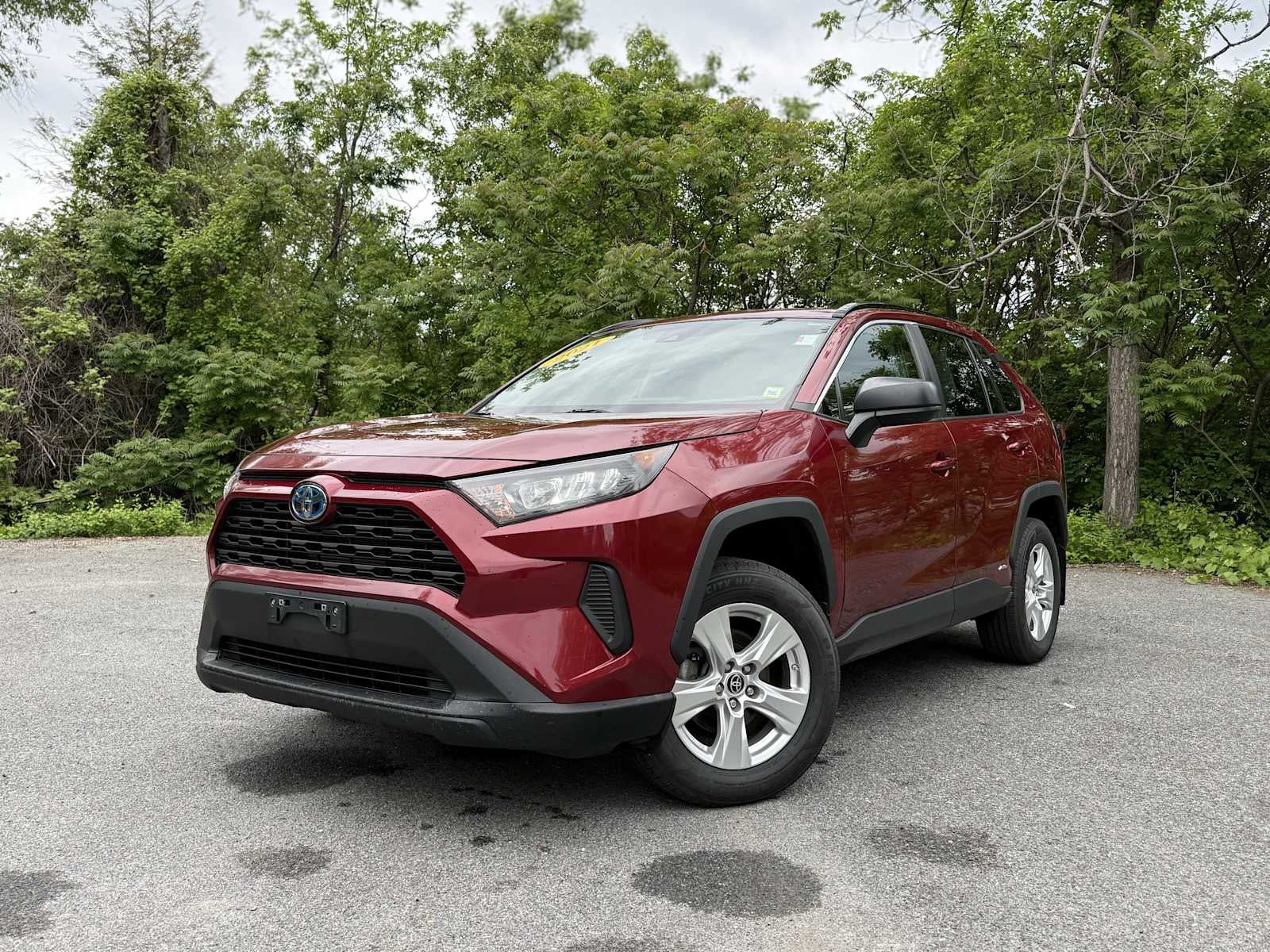 2021 Toyota RAV4 Hybrid LE in Pearl — front three-quarter view