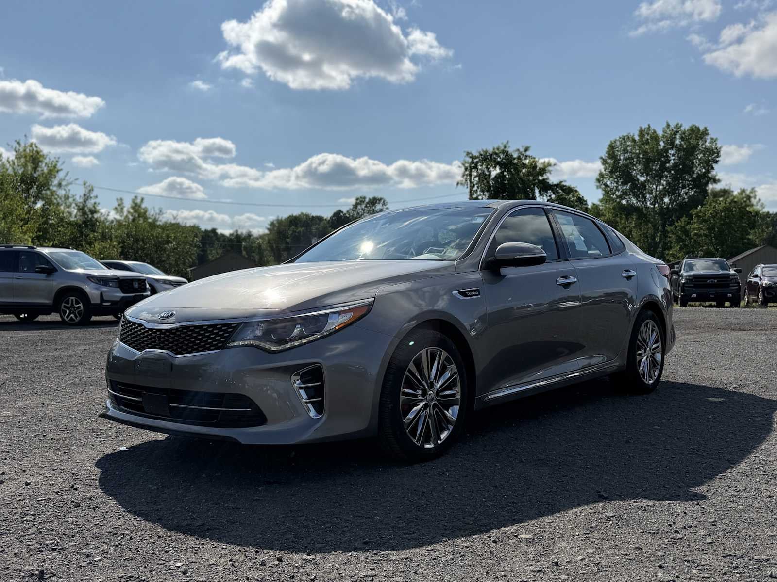 2017 Kia Optima SXL Turbo in Titanium Silver — front three-quarter view