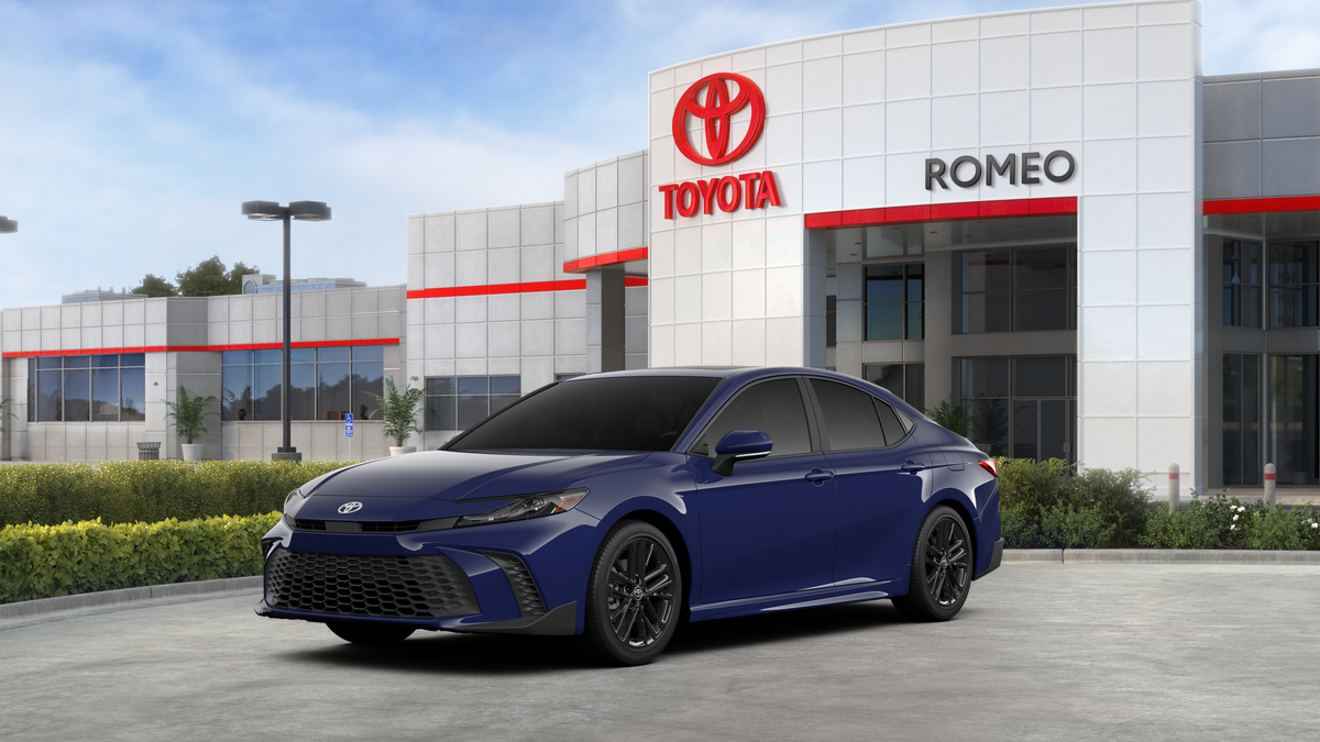 2026 Toyota Camry SE AWD in Reservoir Blue — front three-quarter view